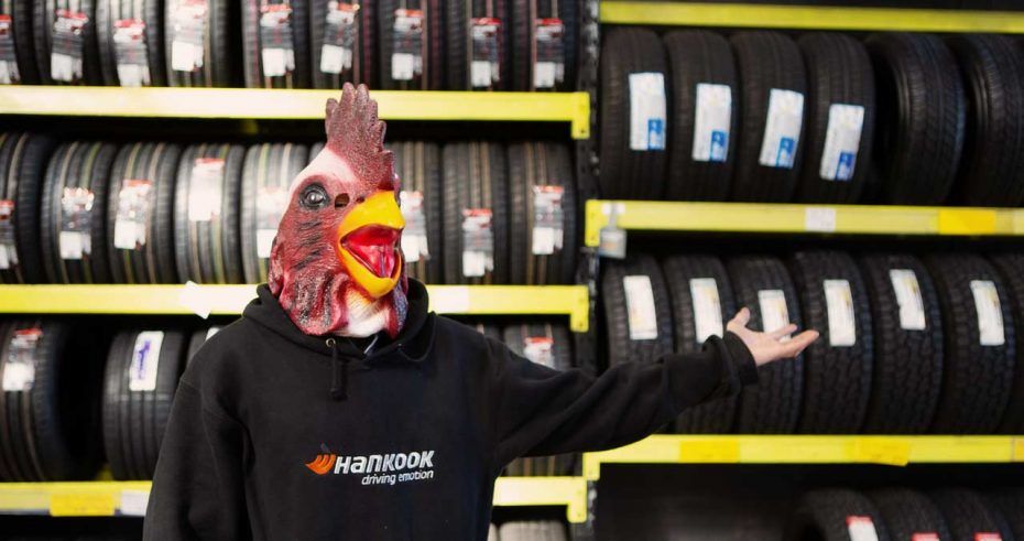 Budget Tyres employee showing off their cheap and affordable tyre range